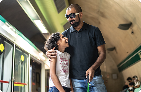 child walking with blind man